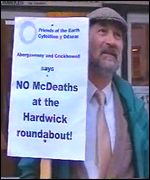 A protester outside the public inquiry